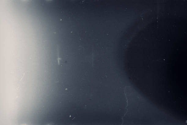 istock Grainy toned film frame with scratches, dust and grain 1260128270