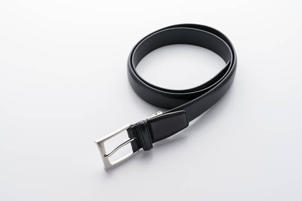 istock Twisted black male leather belt isolated on a white background 1260129958