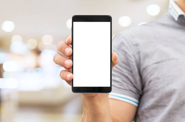 istock Man holding mobile smart phone with blank screen 1260132153