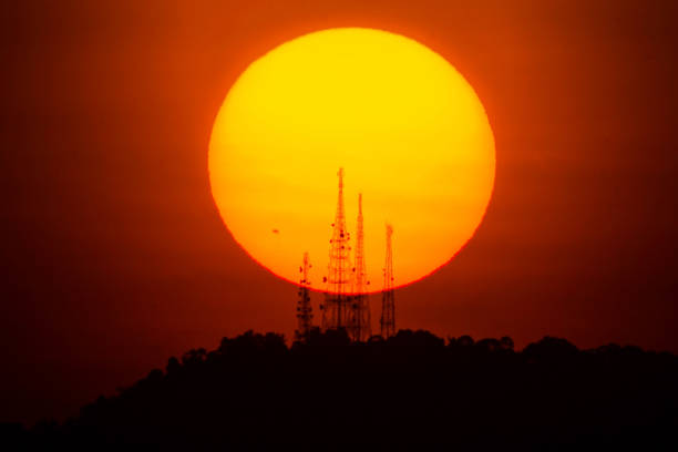 istock Isolated sun view with silhouette for blur background 1260133402