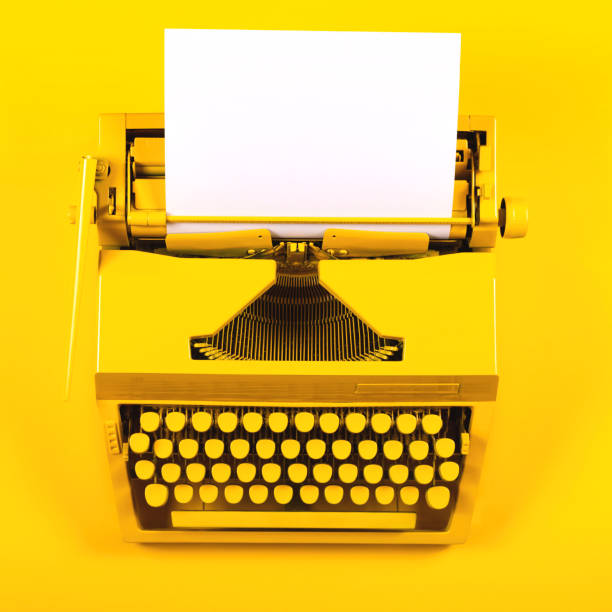 istock Yellow bright typewriter on a yellow background. Creativity concept 1260138898