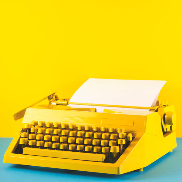 istock Yellow bright typewriter on a yellow background. Creativity concept 1260139415