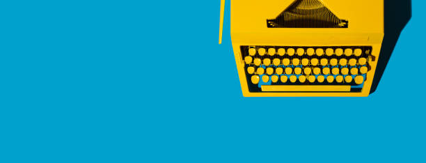 Yellow bright typewriter on blue background. Creativity concept Yellow bright typewriter on blue. Symbol for writing, blogging, new ideas and creativity. Copy space banner copywriter photos stock pictures, royalty-free photos & images
