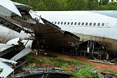 Airplane crash scene on the ground.