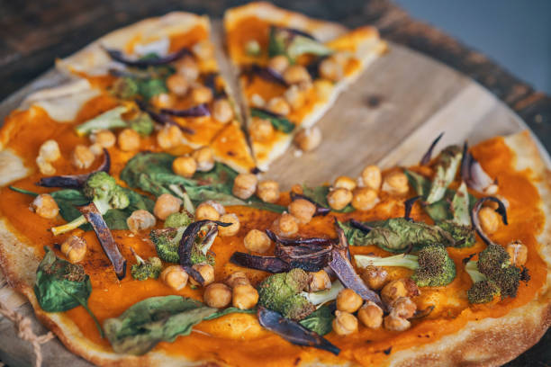 istock Vegan Pumpkin Pizza with Broccoli, Chickpeas and Spinach 1260145389