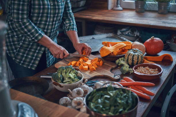 istock Preparing Vegan Pumpkin Pizza with Broccoli, Chickpeas and Spinach 1260147650