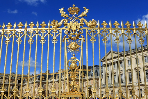 Europe. France. Ile-de-France. Yvelines. Versailles. 09/30/2017. This colorful image depicts the royal gate gilded with fine gold. The Palace of Versailles.