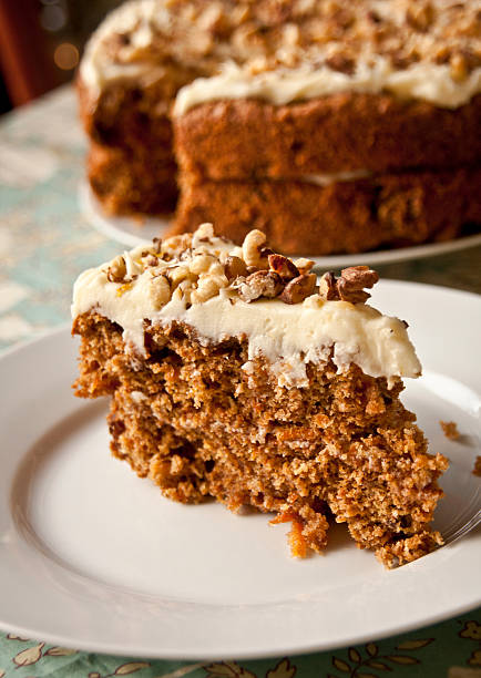 istock Slide of carrot cake with nuts for topping 126017221