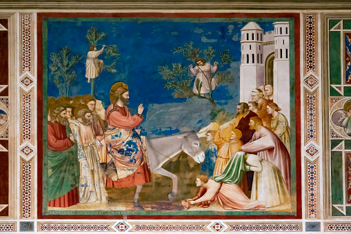Fresco painted by Giotto. Jesus arrives in Jerusalem riding a donkey.