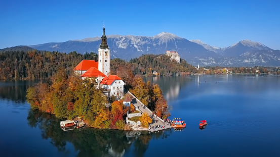 Lake Bled located in Slovenia Europe. There is a church on the island and old castle on a rock above the lake.