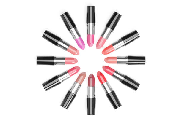 istock Lipsticks of different colors arranged in a circle on white background. 1260184886