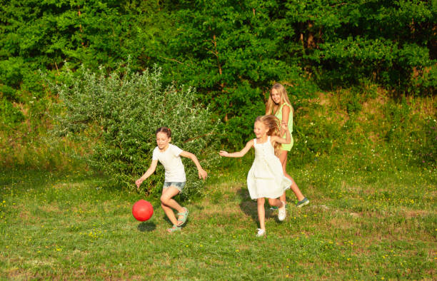 istock Children Running in Summer Meadow 1260199117