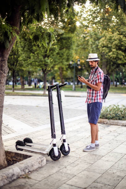istock Young man with an electric scooter 1260204463