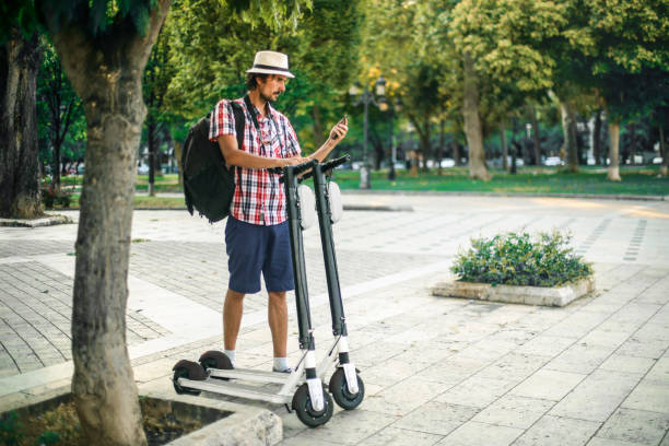 istock Young man driving an electric scooter 1260204464