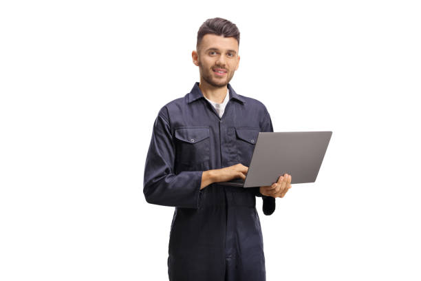 istock Auto mechanic worker holding a laptop computer and looking at the camera 1260206066