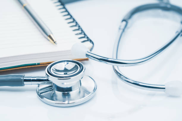 istock Medical stethoscope for doctor checkup and notepad on table 1260213131