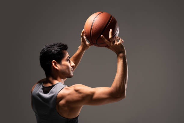 istock Handsome Male Athlete Playing Basketball 1260217460