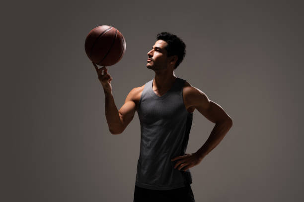 istock Hispanic Athletic Man With Basketball 1260217473