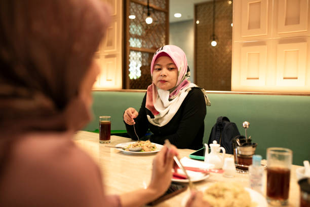 istock happy asian friends having dinner together 1260218586