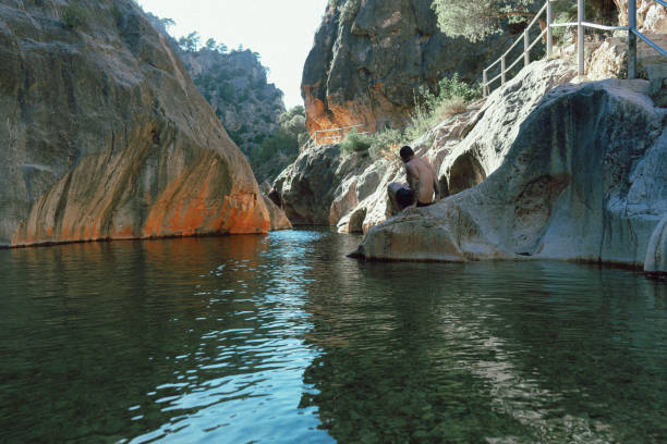 istock Man bathing in the waters of a wild spa 1260221933