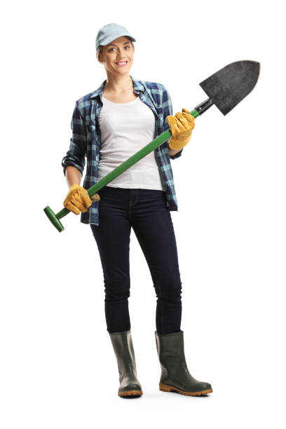 istock Female farmer in boots holding a shovel 1260228514