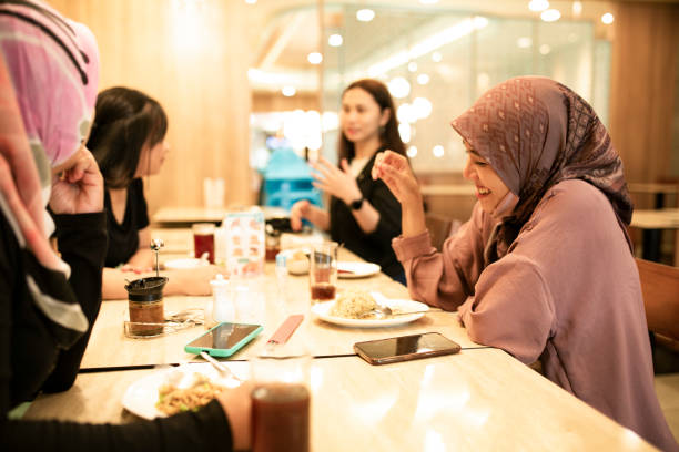 istock happy asian friends having dinner together 1260232414