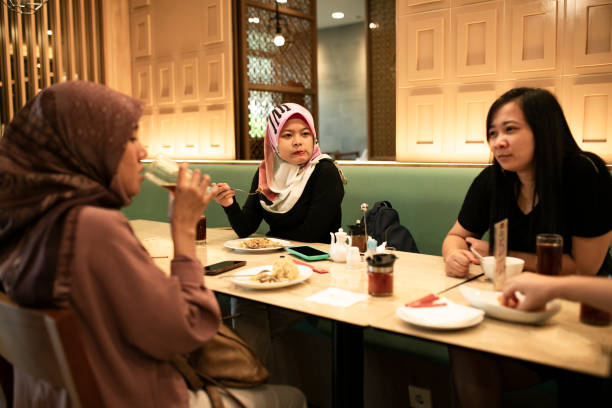 istock happy asian friends having dinner together 1260232415