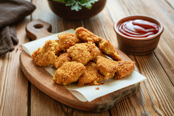 istock Homemade Chicken Nuggets on a Cutting Board 1260236733