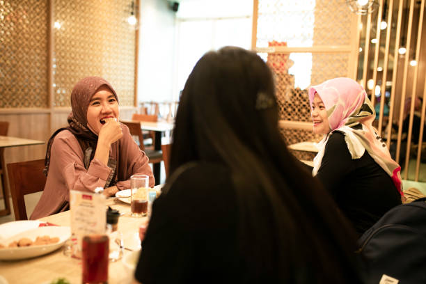 istock happy asian friends having dinner together 1260244134