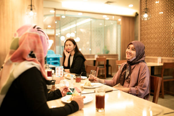 istock happy asian friends having dinner together 1260252362