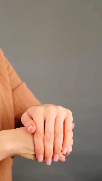 istock a woman who is rubbing her hands 1260285443