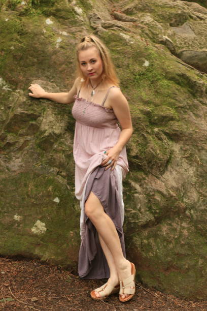istock Beautiful Woman and a Rock 1260305535