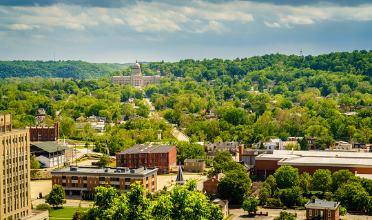 Aerial view of downtown Frankfort, KY with the State Capitol building
