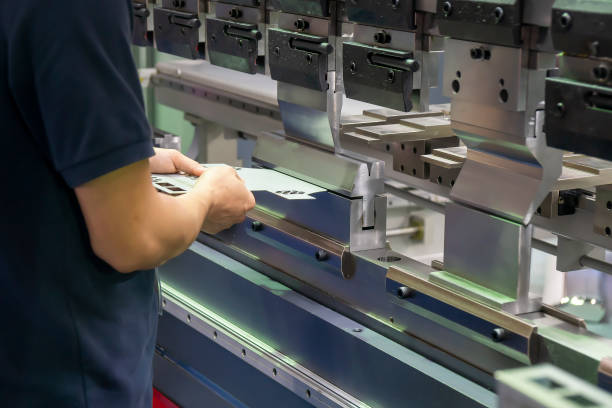 istock The operation of hydraulic bending machine with technician. 1260312520