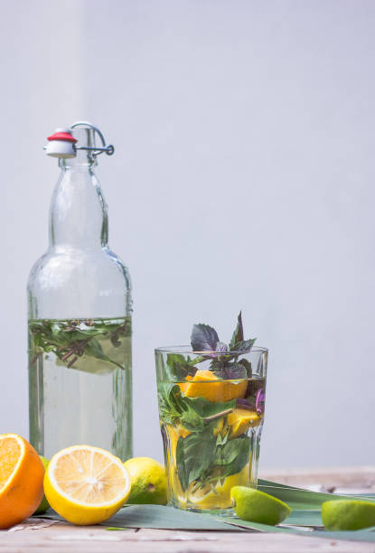 istock Basil smash gin alcoholic cocktail with fresh basil leaves and citrus. 1260318227