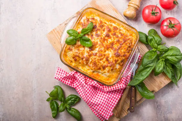 Delicious traditional italian lasagna made with minced beef bolognese sauce