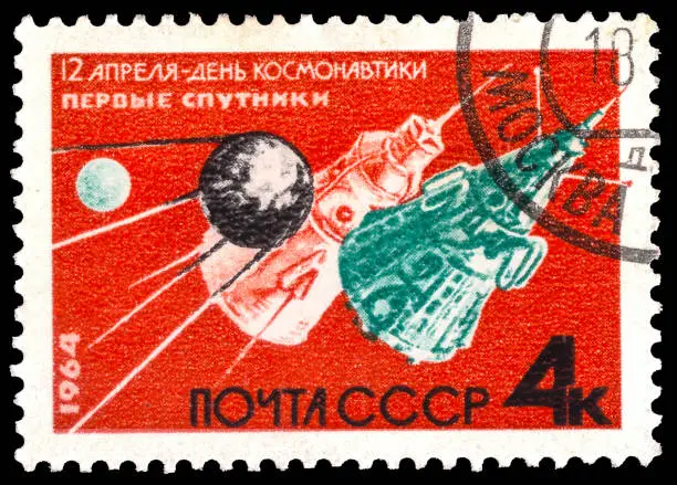 Photo of Russia  - CIRCA June 20, 1964: A stamp printed by Anniv of cosmonautics day USSR MOSCOW, : A stamp printed in USSR (Russia) shows The first sputniks, Cosmonautics Day serie, circa 1964