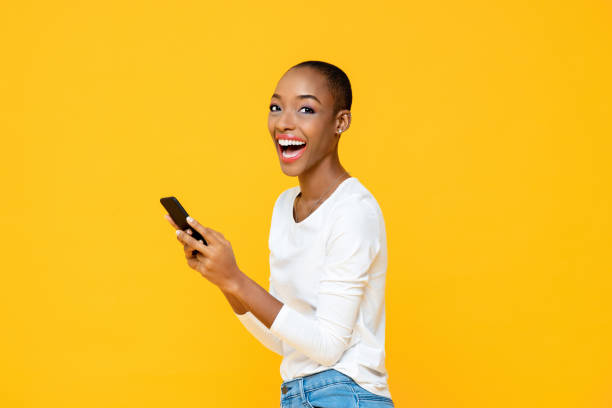 istock Excited smiling African American woman enjoying using application on smartphone 1260336861