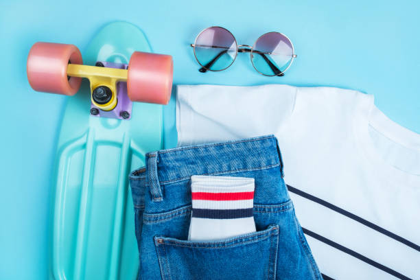 istock Sport inspired flatlay with turquoise penny skateboard 1260350548