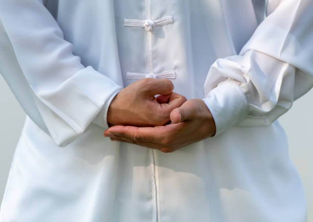 istock Asian man doing Tai Chi in the park. 1260353837