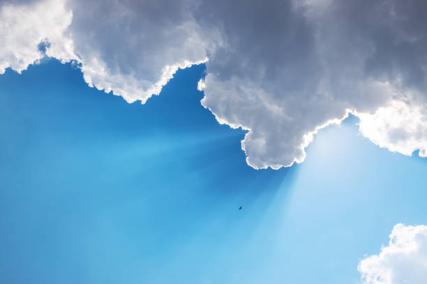 istock Sun, sunbeam and clouds in blue sky 1260359910