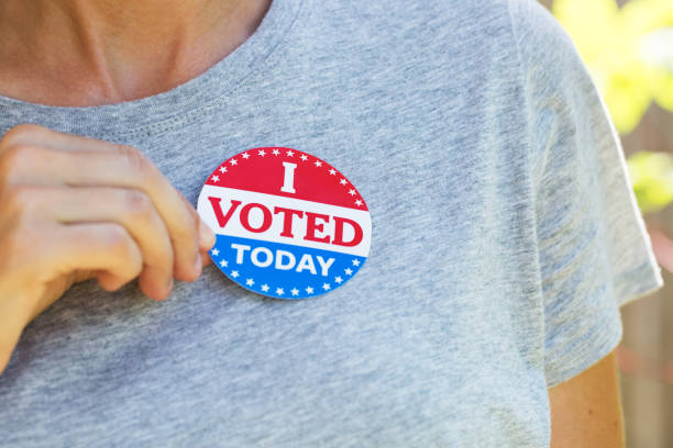 istock Hand holding I voted today sticker 1260365884