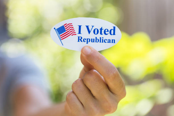 istock Hand holding I voted Republican sticker 1260367462