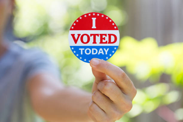 istock Hand holding I voted today sticker 1260370742