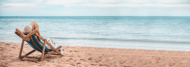 istock Young woman lying on the beach chair. 1260379410