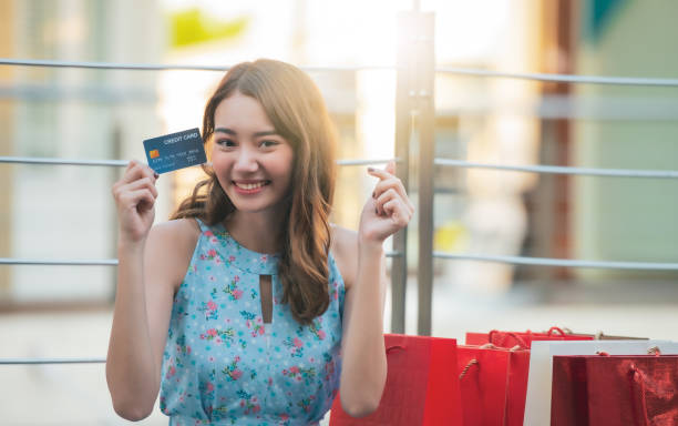 istock Shopping woman with credit card. 1260386400