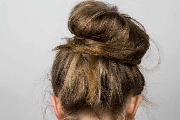 istock Hair tied in a bun 1260387036