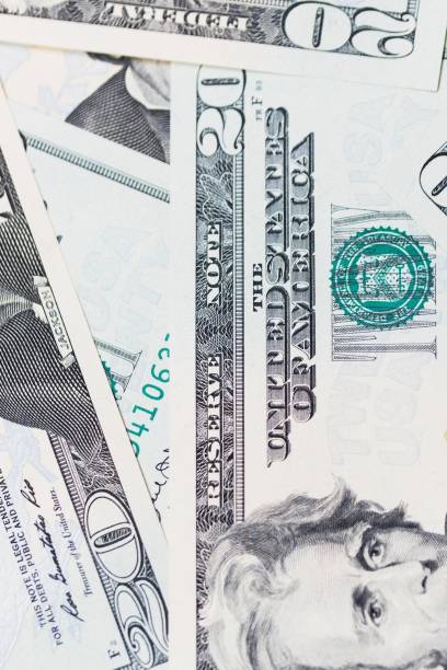 istock Close up photo scattered US $20 bills 1260390298