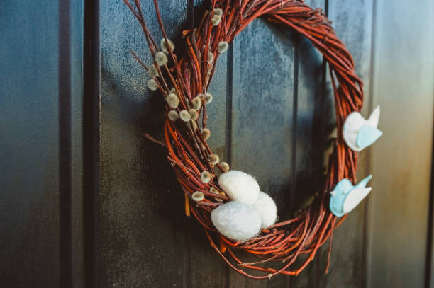 istock Wicker wreath of willow branches, decorated with birds and eggs. 1260420647