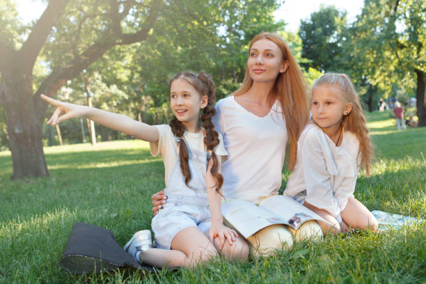 istock Kids studying outdoors in the park 1260421720
